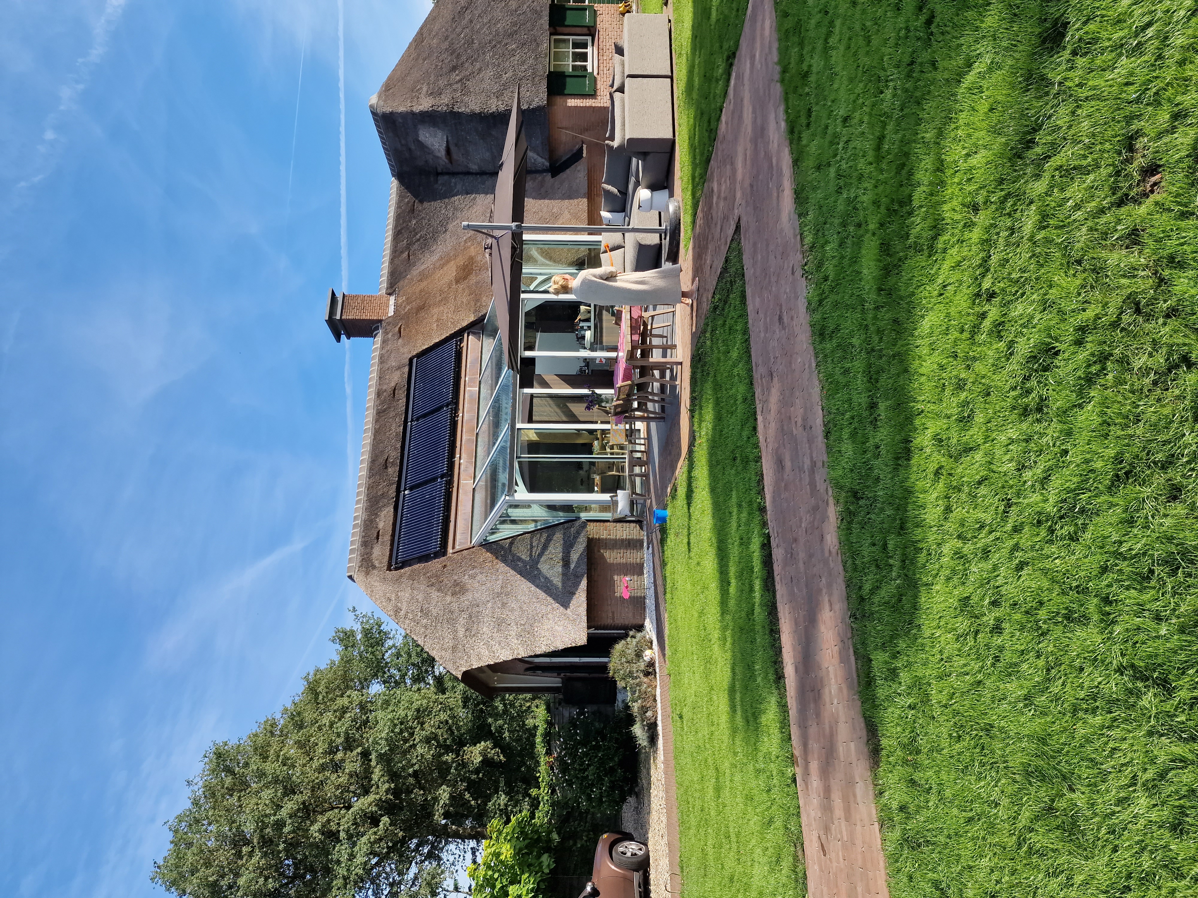 Glazen serre-uitbouw aan stolpboerderij, Holten